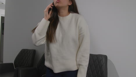 Angry-Anxious-Or-Stressed-Woman-Having-Argument-On-Mobile-Phone-At-Work-In-Office-Building